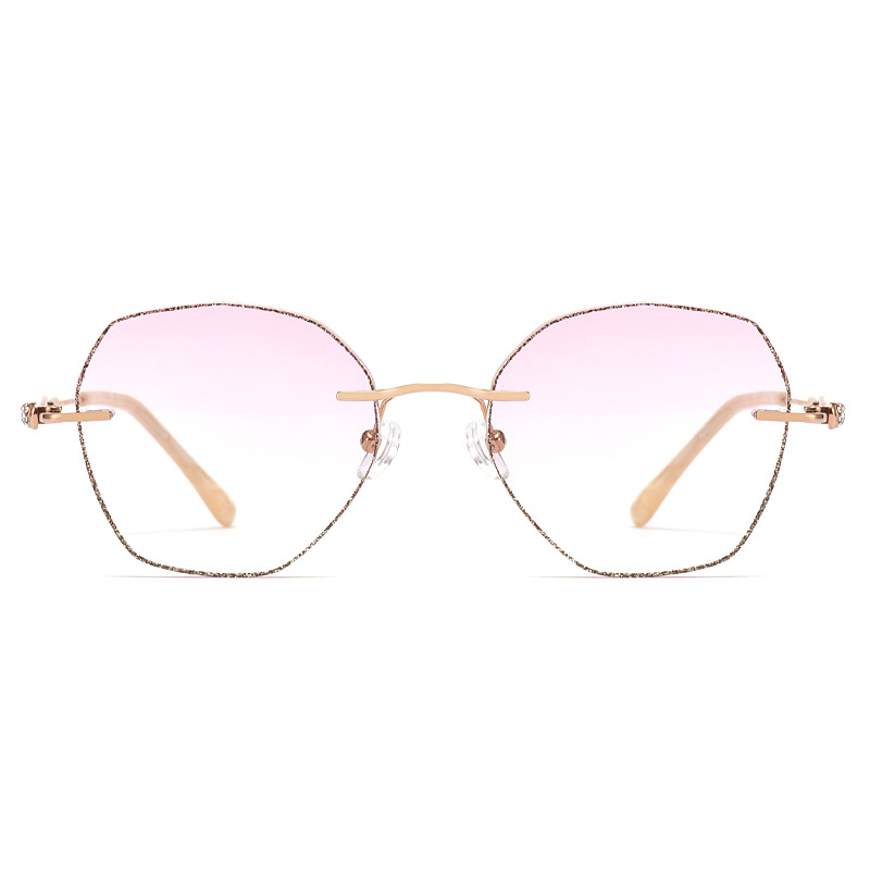 Elevate your style with MieMie Glitter Polygon Rimless Glasses. Featuring durable Metal frames in Champagne Gold with rhinestone embellishment. Our ALL-IN-ONE lenses offer blue light protection, anti-glare, and more at no extra cost. Perfect for fashion-forward Gen Z trendsetters!