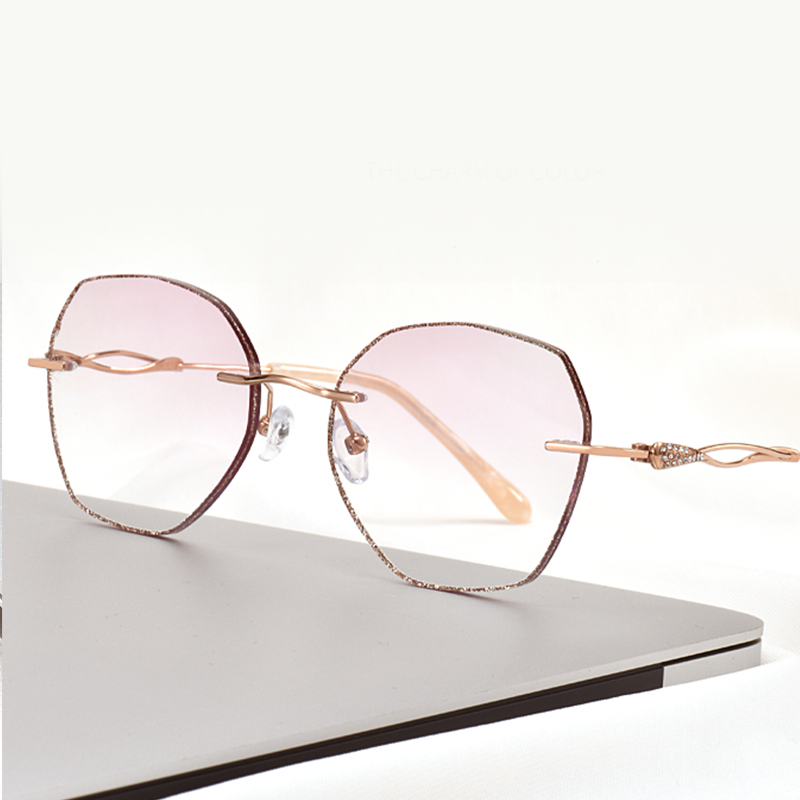 Elevate your style with MieMie Glitter Polygon Rimless Glasses. Featuring durable Metal frames in Champagne Gold with rhinestone embellishment. Our ALL-IN-ONE lenses offer blue light protection, anti-glare, and more at no extra cost. Perfect for fashion-forward Gen Z trendsetters!