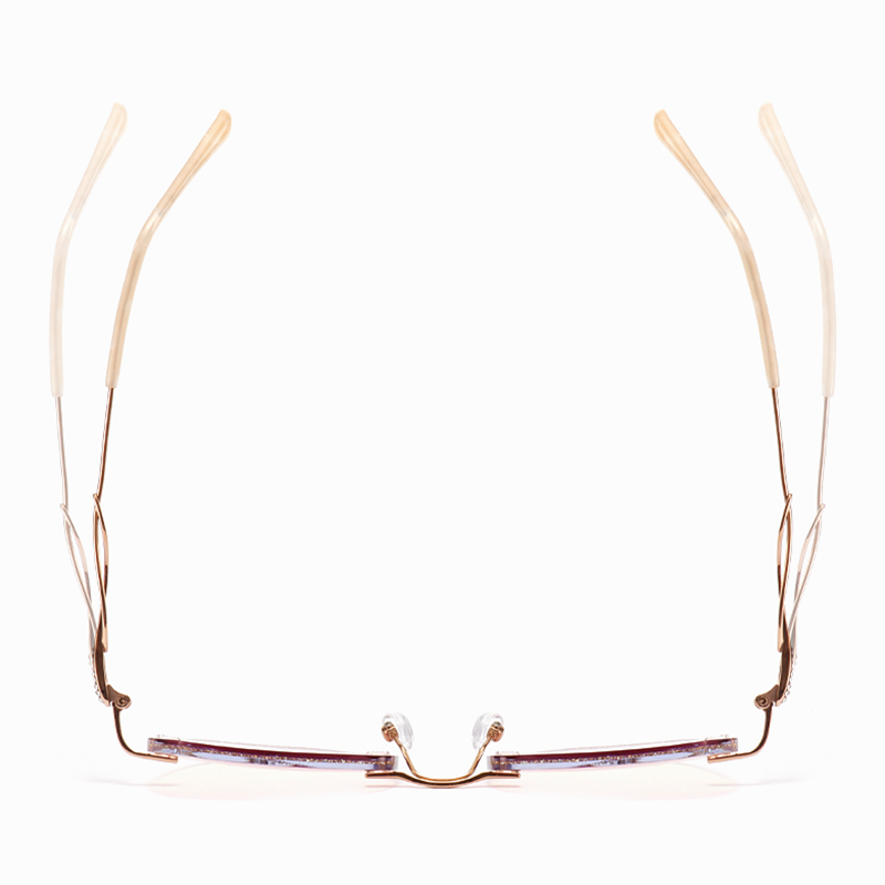 Elevate your style with MieMie Glitter Polygon Rimless Glasses. Featuring durable Metal frames in Champagne Gold with rhinestone embellishment. Our ALL-IN-ONE lenses offer blue light protection, anti-glare, and more at no extra cost. Perfect for fashion-forward Gen Z trendsetters!