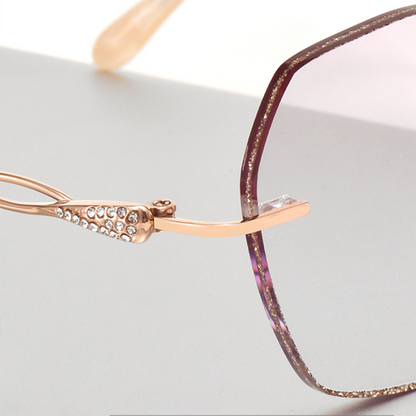 Elevate your style with MieMie Glitter Polygon Rimless Glasses. Featuring durable Metal frames in Champagne Gold with rhinestone embellishment. Our ALL-IN-ONE lenses offer blue light protection, anti-glare, and more at no extra cost. Perfect for fashion-forward Gen Z trendsetters!