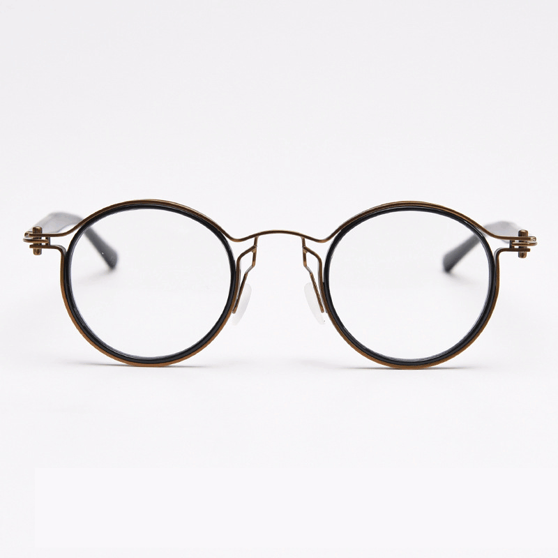 Featuring MieMie PRO003 modern steampunk round frame accented with metal stripes. Made from a seamless blend of lightweight acetate and sturdy metal, comes in 5 color: Black Tortoise, Bronze, Gold, Silver & Red. Multifunction all-in-one lenses. Embody sophistication and enhance any outfit.