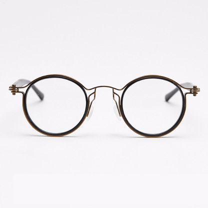 Featuring MieMie PRO003 modern steampunk round frame accented with metal stripes. Made from a seamless blend of lightweight acetate and sturdy metal, comes in 5 color: Black Tortoise, Bronze, Gold, Silver & Red. Multifunction all-in-one lenses. Embody sophistication and enhance any outfit.