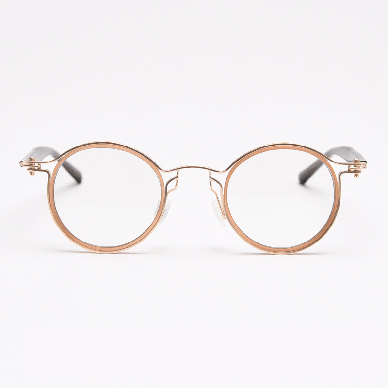 Featuring MieMie PRO003 modern steampunk round frame accented with metal stripes. Made from a seamless blend of lightweight acetate and sturdy metal, comes in 5 color: Black Tortoise, Bronze, Gold, Silver & Red. Multifunction all-in-one lenses. Embody sophistication and enhance any outfit.