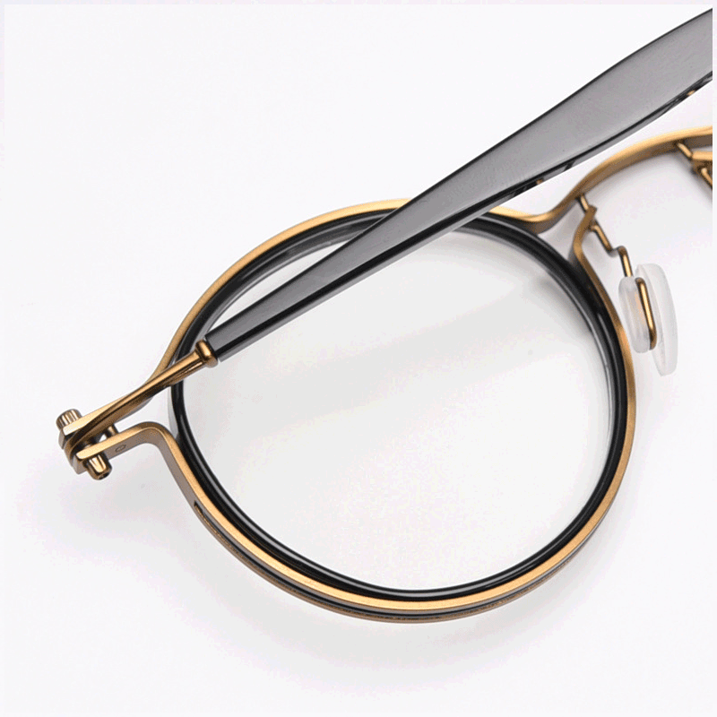 Featuring MieMie PRO003 modern steampunk round frame accented with metal stripes. Made from a seamless blend of lightweight acetate and sturdy metal, comes in 5 color: Black Tortoise, Bronze, Gold, Silver & Red. Multifunction all-in-one lenses. Embody sophistication and enhance any outfit.