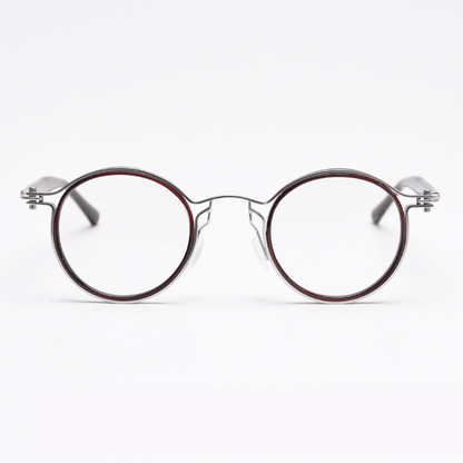 Featuring MieMie PRO003 modern steampunk round frame accented with metal stripes. Made from a seamless blend of lightweight acetate and sturdy metal, comes in 5 color: Black Tortoise, Bronze, Gold, Silver & Red. Multifunction all-in-one lenses. Embody sophistication and enhance any outfit.