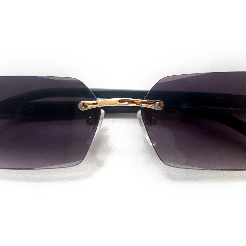 MieMie SSQ007 Rectangle rimless sunglasses feature with polished and sophisticated metal and detail cut lenses. This lightweight frame is functional eyewear without any unnecessary embellishments. For added durability, it comes with impact-resistant polycarbonate lenses. Comes in 6 colors: Purple, Apricot, Black, Brown, Blue, Green