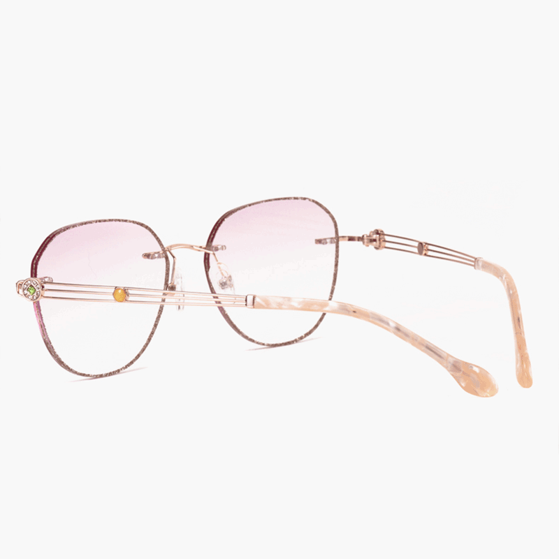 PR016 rimless glitter-powder-studded eyeglasses are crafted from elegant metal, making them incredibly lightweight and comfortable. They feature slender temple arms and gradient light pink tinted lenses, ideal for women during the summer.