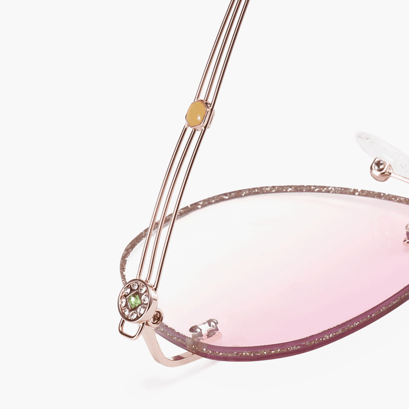 PR016 rimless glitter-powder-studded eyeglasses are crafted from elegant metal, making them incredibly lightweight and comfortable. They feature slender temple arms and gradient light pink tinted lenses, ideal for women during the summer.