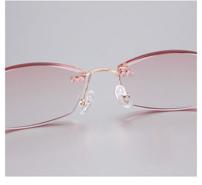 Upgrade your eyewear with MieMie's Pink Rectangle frame glasses, featuring a stylish design for instant transition between prescription eyewear and sunglasses. All-in-One lenses come with multi-coating benefits: anti-blue light, anti-allergic, anti-scratch, anti-glare, and oil-resistant protection, all included at one price.