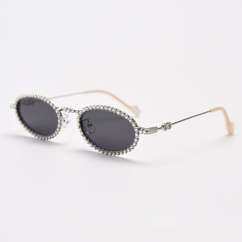 MieMie SR006 Round Oval Stylish Sunglasses, made from metal with a distinctive diamond rhinestone design. Equipped with polarized UV400 protection, these sunglasses offer exceptional defense against harmful rays, available in gold and silver color.