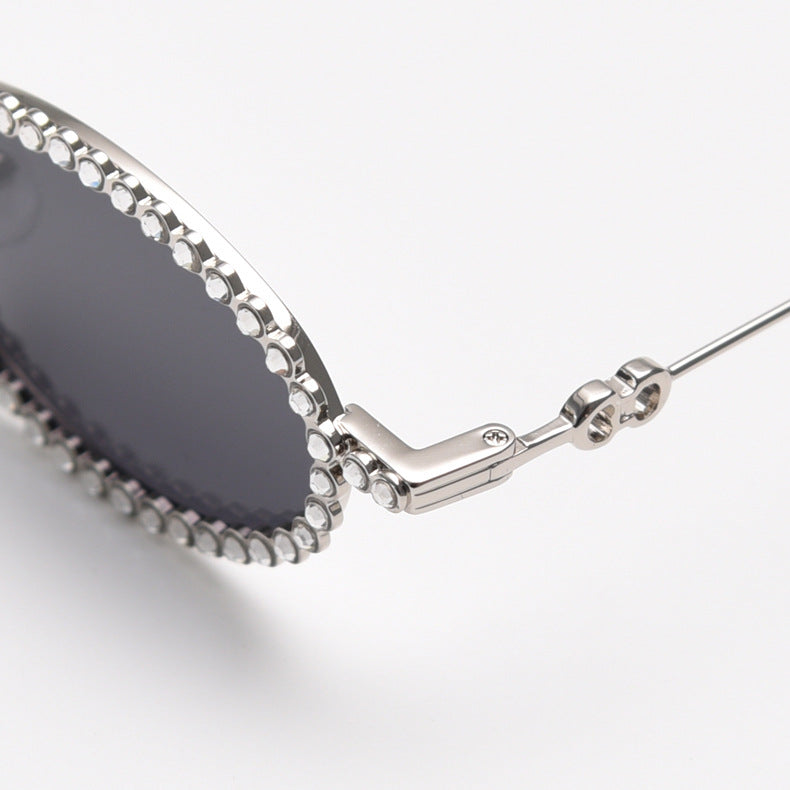 MieMie SR006 Round Oval Stylish Sunglasses, made from metal with a distinctive diamond rhinestone design. Equipped with polarized UV400 protection, these sunglasses offer exceptional defense against harmful rays, available in gold and silver color.