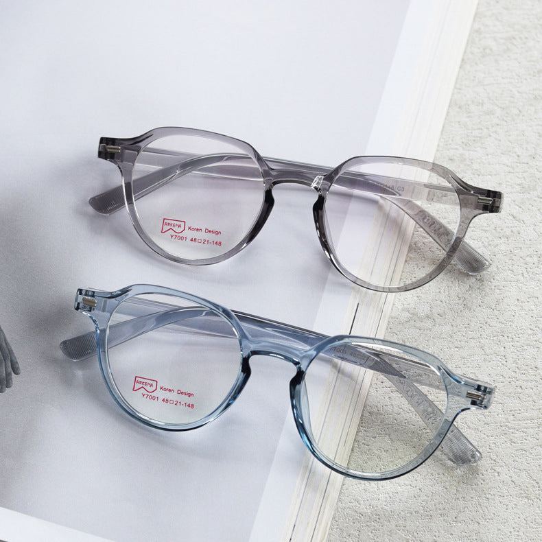 MieMie bold round glasses with retro-chic style and ALL-IN-ONE lenses: Anti-blue, Anti-glare, Anti-scratch, Anti-allergic, and Oil-resistant. Available in pink, black, grey, gradient brown, brown, and blue. Perfect for prescription or fashion wear.