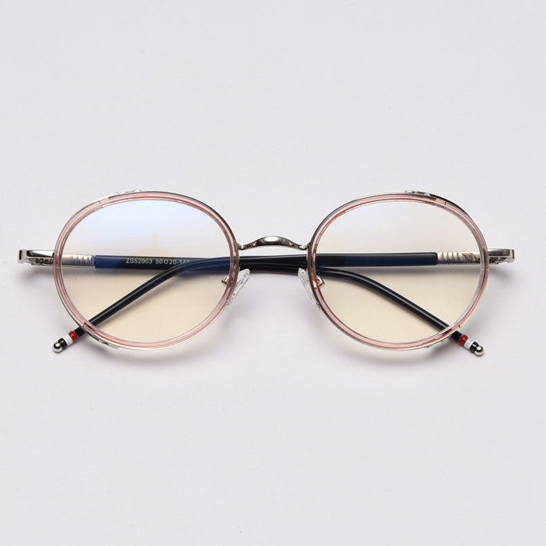 MieMie PR010 modern steampunk round prescription eyeglasses frame, made from TR90 material perfect for a stylish look. These small, lightweight frames come in various colors. Features ALL-IN-ONE lenses with multi-coating benefits like Anti-blue, Anti-scratch, and more, at no extra cost. Comes in 5 colors: Pink, Grey, Clear, Black, Brown