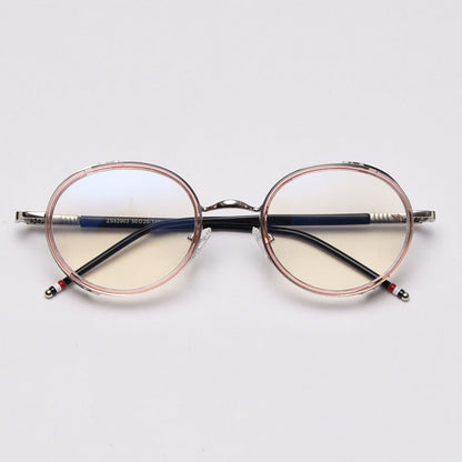 MieMie PR010 modern steampunk round prescription eyeglasses frame, made from TR90 material perfect for a stylish look. These small, lightweight frames come in various colors. Features ALL-IN-ONE lenses with multi-coating benefits like Anti-blue, Anti-scratch, and more, at no extra cost. Comes in 5 colors: Pink, Grey, Clear, Black, Brown