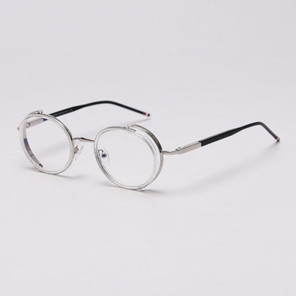 MieMie PR010 modern steampunk round prescription eyeglasses frame, made from TR90 material perfect for a stylish look. These small, lightweight frames come in various colors. Features ALL-IN-ONE lenses with multi-coating benefits like Anti-blue, Anti-scratch, and more, at no extra cost. Comes in 5 colors: Pink, Grey, Clear, Black, Brown