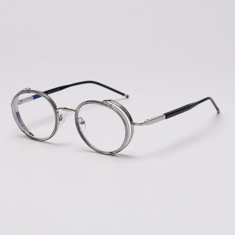 MieMie PR010 modern steampunk round prescription eyeglasses frame, made from TR90 material perfect for a stylish look. These small, lightweight frames come in various colors. Features ALL-IN-ONE lenses with multi-coating benefits like Anti-blue, Anti-scratch, and more, at no extra cost. Comes in 5 colors: Pink, Grey, Clear, Black, Brown