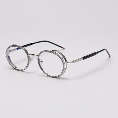 MieMie PR010 modern steampunk round prescription eyeglasses frame, made from TR90 material perfect for a stylish look. These small, lightweight frames come in various colors. Features ALL-IN-ONE lenses with multi-coating benefits like Anti-blue, Anti-scratch, and more, at no extra cost. Comes in 5 colors: Pink, Grey, Clear, Black, Brown