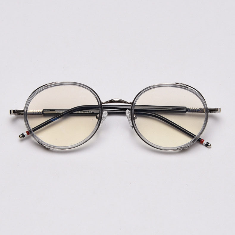 MieMie PR010 modern steampunk round prescription eyeglasses frame, made from TR90 material perfect for a stylish look. These small, lightweight frames come in various colors. Features ALL-IN-ONE lenses with multi-coating benefits like Anti-blue, Anti-scratch, and more, at no extra cost. Comes in 5 colors: Pink, Grey, Clear, Black, Brown