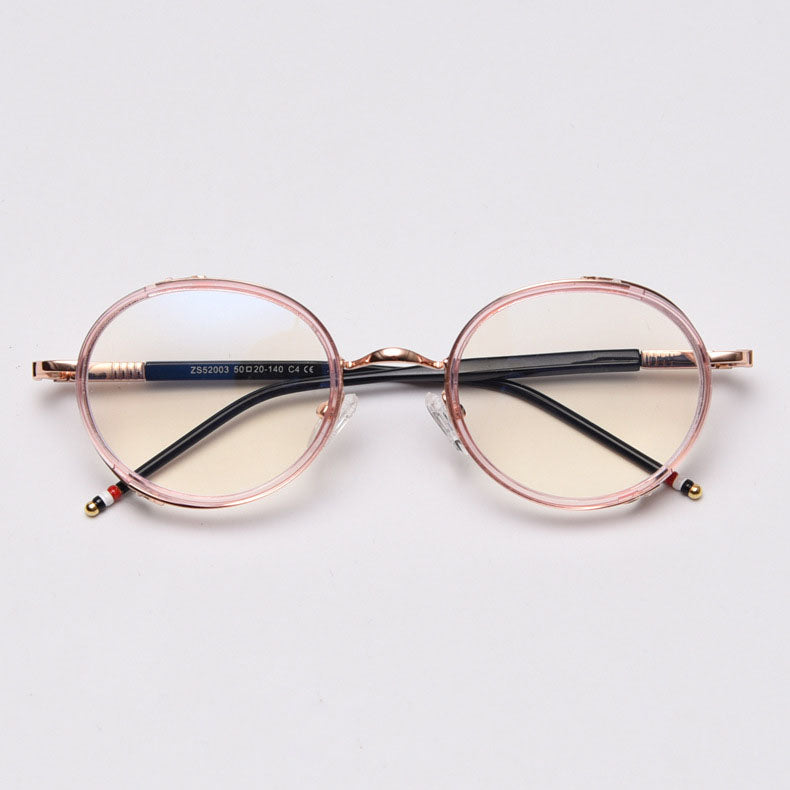 MieMie PR010 modern steampunk round prescription eyeglasses frame, made from TR90 material perfect for a stylish look. These small, lightweight frames come in various colors. Features ALL-IN-ONE lenses with multi-coating benefits like Anti-blue, Anti-scratch, and more, at no extra cost. Comes in 5 colors: Pink, Grey, Clear, Black, Brown