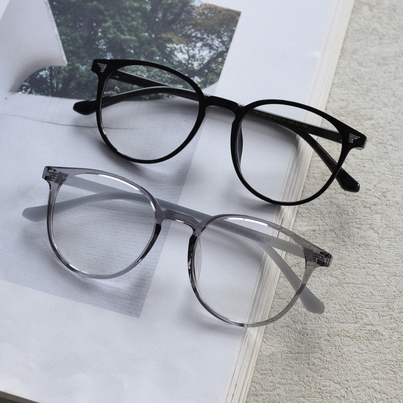 TR90 round frames in glossy black, transparent gray, white, olive green, coffee, cool-tone tea, gradient tea, and gradient coffee. Features ALL-IN-ONE lenses with multi-layer coatings: Anti-blue, Anti-allergic, scratch-resistant, anti-glare, and oil-resistant.