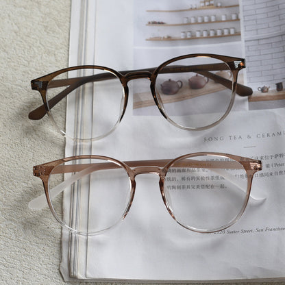 TR90 round frames in glossy black, transparent gray, white, olive green, coffee, cool-tone tea, gradient tea, and gradient coffee. Features ALL-IN-ONE lenses with multi-layer coatings: Anti-blue, Anti-allergic, scratch-resistant, anti-glare, and oil-resistant.