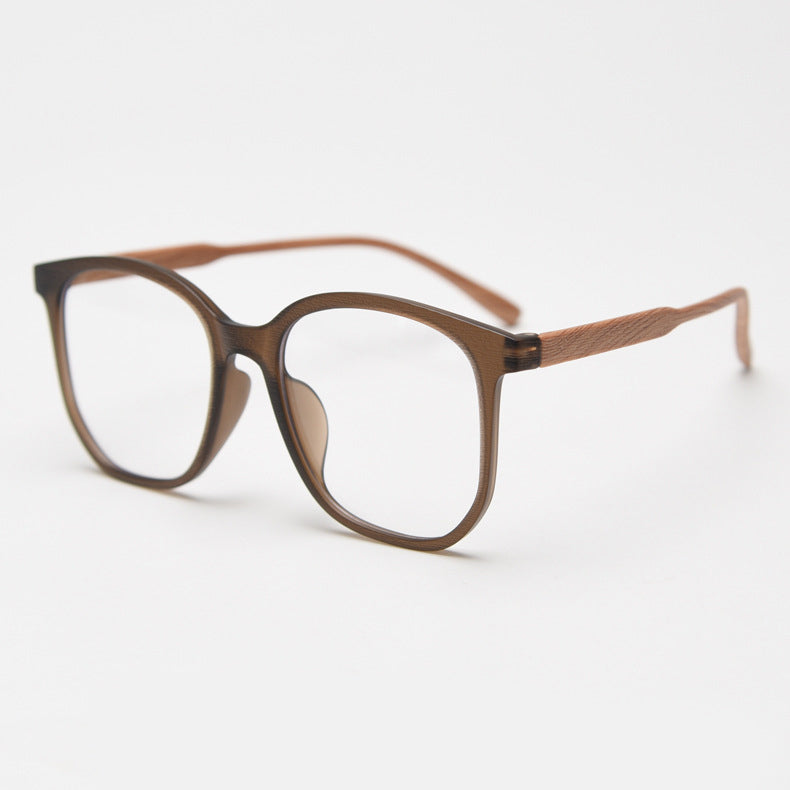 MieMie affordable TR90 wood-textured oversized eyeglass frames in multiple colors, including Brown, Coffee, Green, Grey, Tortoise, and Matte Black. Features ALL-IN-ONE lenses with multi-coating benefits like Anti-blue, Anti-scratch, Anti-glare, Anti-allergic, and Oil-resistant, offering a stylish and face-slimming look.