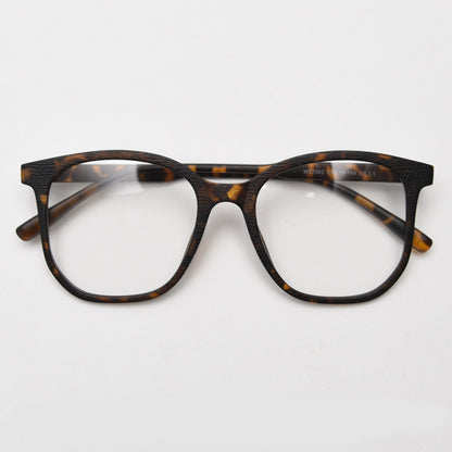 MieMie affordable TR90 wood-textured oversized eyeglass frames in multiple colors, including Brown, Coffee, Green, Grey, Tortoise, and Matte Black. Features ALL-IN-ONE lenses with multi-coating benefits like Anti-blue, Anti-scratch, Anti-glare, Anti-allergic, and Oil-resistant, offering a stylish and face-slimming look.