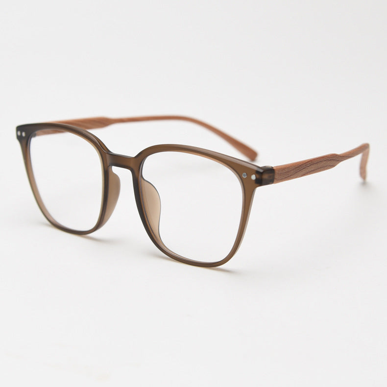 MieMie affordable TR90 wood-textured oversized eyeglass frames in multiple colors, including Brown, Coffee, Green, Grey, Tortoise, and Matte Black. Features ALL-IN-ONE lenses with multi-coating benefits like Anti-blue, Anti-scratch, Anti-glare, Anti-allergic, and Oil-resistant, offering a stylish and face-slimming look.