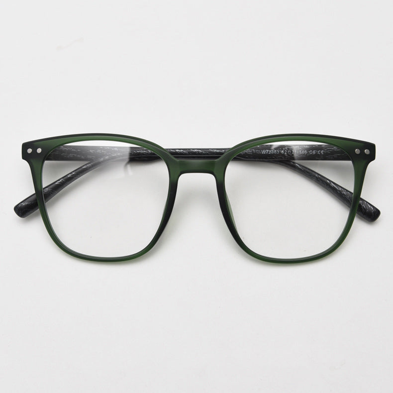 MieMie affordable TR90 wood-textured oversized eyeglass frames in multiple colors, including Brown, Coffee, Green, Grey, Tortoise, and Matte Black. Features ALL-IN-ONE lenses with multi-coating benefits like Anti-blue, Anti-scratch, Anti-glare, Anti-allergic, and Oil-resistant, offering a stylish and face-slimming look.