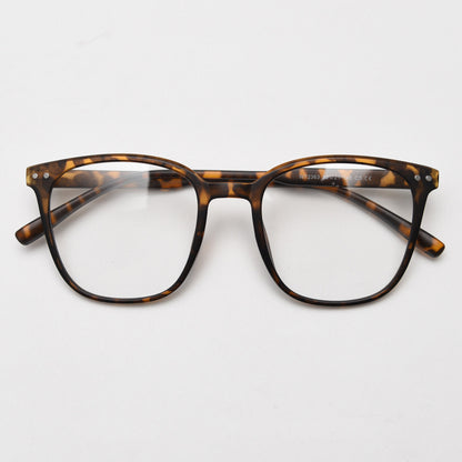 MieMie affordable TR90 wood-textured oversized eyeglass frames in multiple colors, including Brown, Coffee, Green, Grey, Tortoise, and Matte Black. Features ALL-IN-ONE lenses with multi-coating benefits like Anti-blue, Anti-scratch, Anti-glare, Anti-allergic, and Oil-resistant, offering a stylish and face-slimming look.