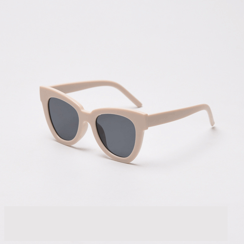 Elevate your style with MieMie SC004 Sunglasses in a striking cream shade for UV400 protection and bold frame. These chic cat-eye frames for women are crafted from lightweight PC material, providing both elegance and durability. Comes in distinctive color choices: pink, black, tortoise, grey, yellow, red, black tortoise, beige