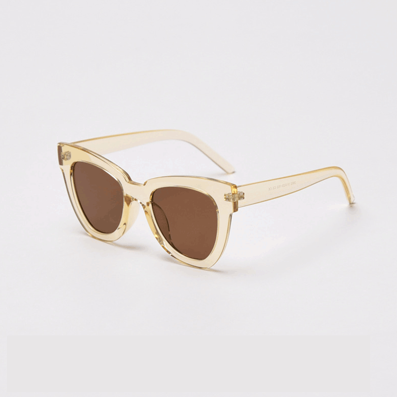 Elevate your style with MieMie SC004 Sunglasses in a striking cream shade for UV400 protection and bold frame. These chic cat-eye frames for women are crafted from lightweight PC material, providing both elegance and durability. Comes in distinctive color choices: pink, black, tortoise, grey, yellow, red, black tortoise, beige