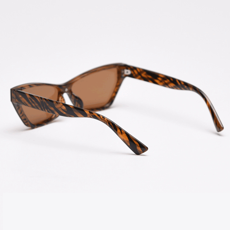 MieMie Bold Cat Eye SC004 Sunglasses combines modern style and bold sophistication! Made with a sturdy PC frame and featuring in Black & Brown, these sunglasses provide both durability and a chic aesthetic, also offers UV400 protection, shielding your eyes from harmful rays.