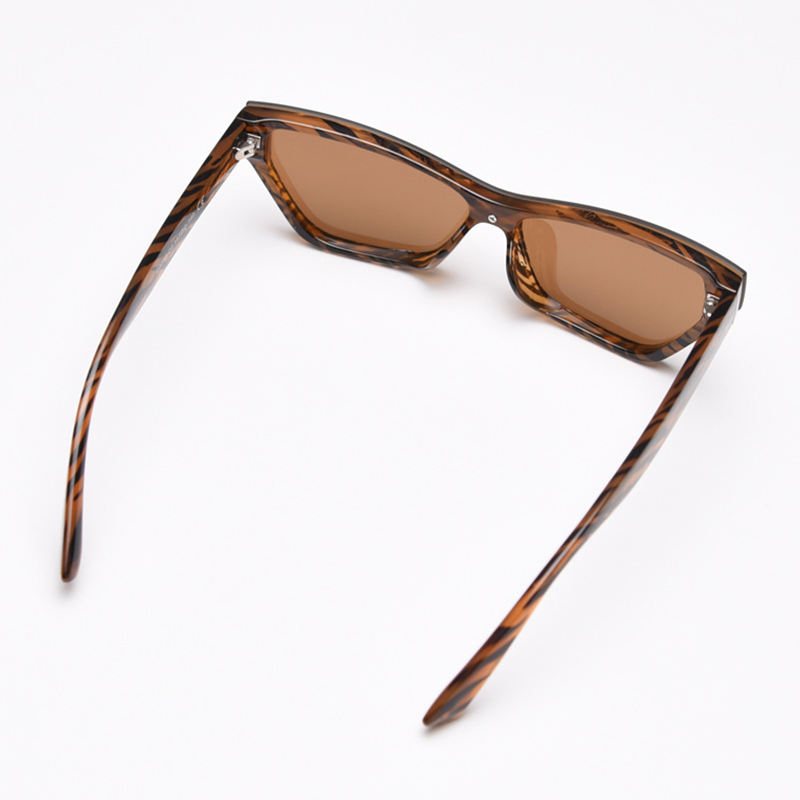 MieMie Bold Cat Eye SC004 Sunglasses combines modern style and bold sophistication! Made with a sturdy PC frame and featuring in Black & Brown, these sunglasses provide both durability and a chic aesthetic, also offers UV400 protection, shielding your eyes from harmful rays.