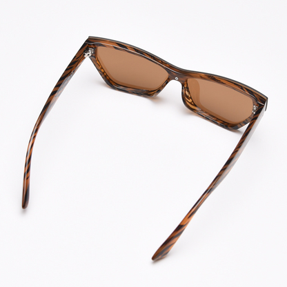 MieMie Bold Cat Eye SC004 Sunglasses combines modern style and bold sophistication! Made with a sturdy PC frame and featuring in Black & Brown, these sunglasses provide both durability and a chic aesthetic, also offers UV400 protection, shielding your eyes from harmful rays.