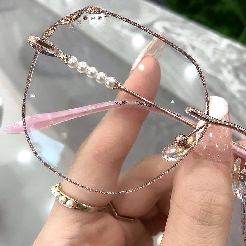 MieMie Shinning Pink Pearl-Embellished polygon glasses. Featuring durable Titanium frames in vibrant pink color. Our ALL-IN-ONE lenses offer blue light protection, anti-glare, and more at no extra cost. Perfect for fashion-forward Gen Z trendsetters!